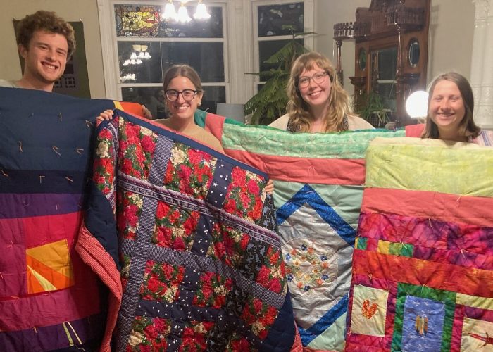 Each year, the San Francisco MVS unit is invited to gather together and craft comforters for themselves. Karen Kreider Yoder, a member of the unit's host congregation, First Mennonite Church of San Francisco, hosts the group at her home for this annual tradition. At the end, each participant takes home their own cozy comforter to use during their service term and beyond! Left to right: Keyan Krabill, Bella Kephart, Emmi Scott and Ana Neufeld Weaver. Photo by Karen Kreider Yoder.