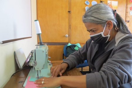 ​Yenny Rangel sews COVID-19 face masks at the Teusaquillo Mennonite Church in Bogotá