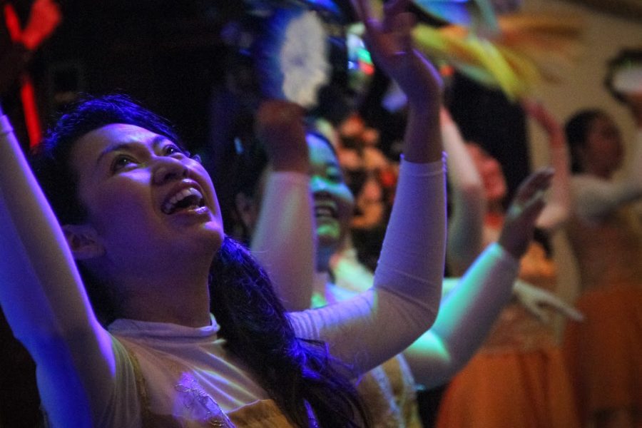 Analia Susanto, the treasurer of Maranatha church, dances for joy with others during worship at Maranatha Church in Indonesia.