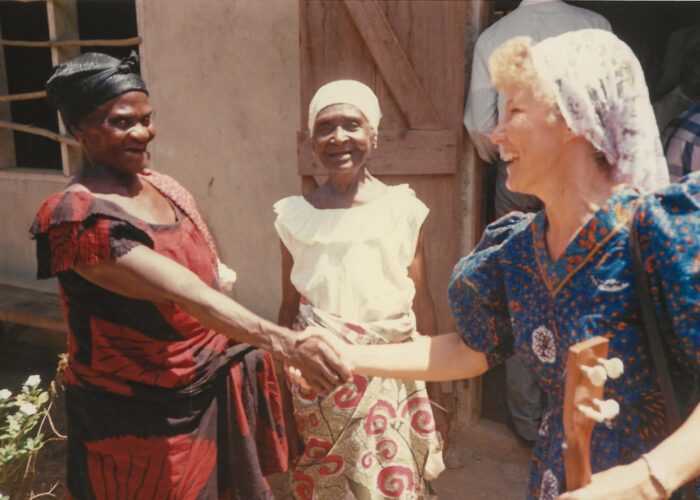 ​Salomey Akweley Gyan and Mary Adorko Lamptey welcome Julie Bender to the Achiaman Mennonite Church in Ghana circa 1991. Photographer: Philip Bender
