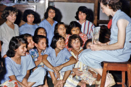 ​Mary Hope Wood Stucky shares Bible stories and prayer with the children at bedtime in the Cachipay