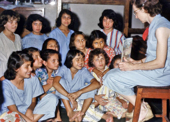 ​Mary Hope Wood Stucky shares Bible stories and prayer with the children at bedtime in the Cachipay