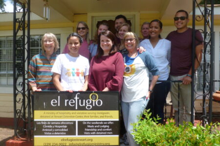 ​A group of Saturday volunteers stop by the El Refugio hospitality house before going over to Steward Detention Center