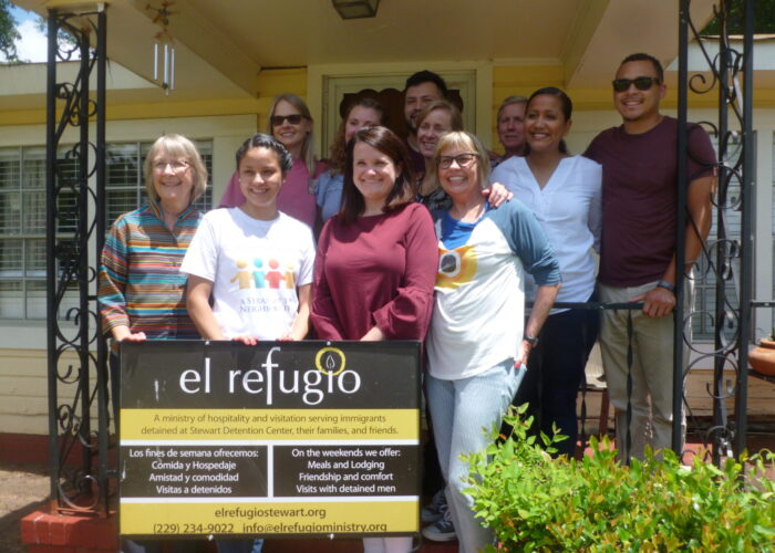 ​A group of Saturday volunteers stop by the El Refugio hospitality house before going over to Steward Detention Center