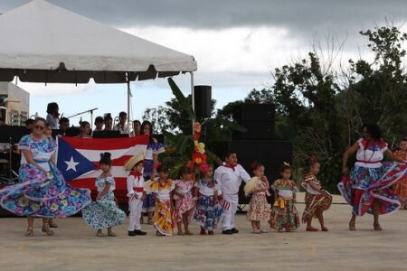 ​Teachers and students of the kindergarten class at Academia Menonita Betania perform a dance at the school's 70th anniversary celebration. Photo by Kayla Berkey. 