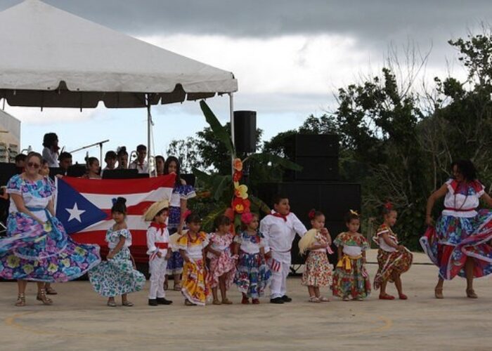 ​Teachers and students of the kindergarten class at Academia Menonita Betania perform a dance at the school's 70th anniversary celebration. Photo by Kayla Berkey. 