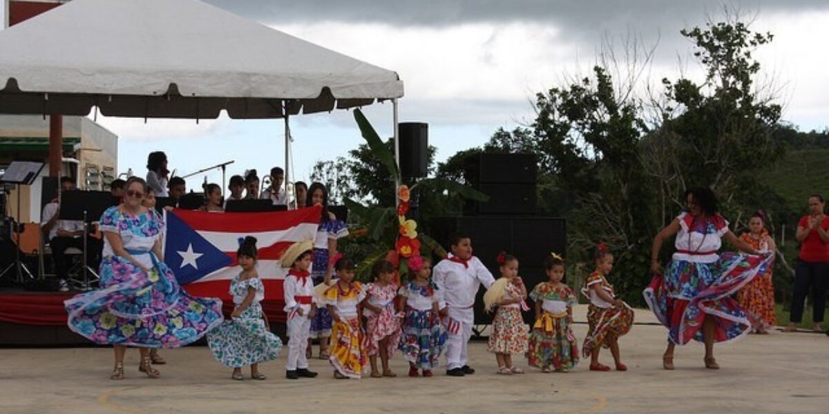 ​Teachers and students of the kindergarten class at Academia Menonita Betania perform a dance at the school's 70th anniversary celebration. Photo by Kayla Berkey. 