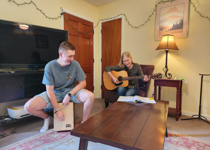 Josia Kämper and Anna Millsap lead music for worship night at the Service Adventure unit house in Jackson