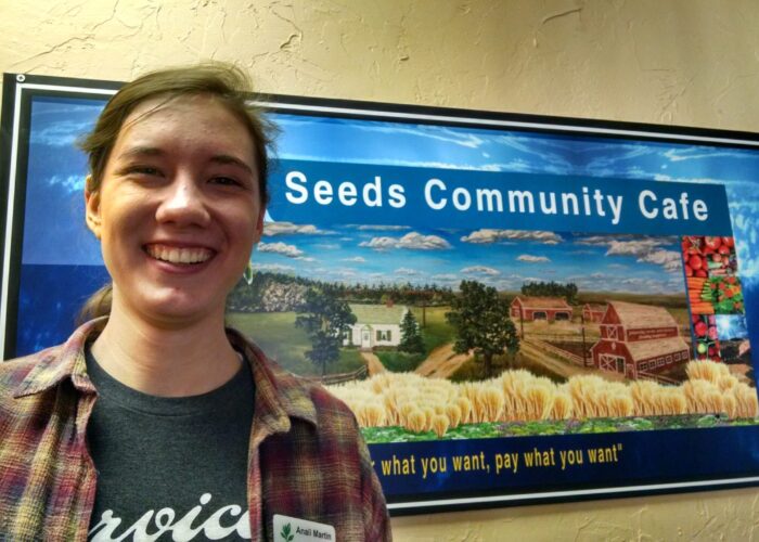 ​Anali North Martin stands outside her placement at Seeds Community Café. Picture taken by Susan Nisly. Click on image for high resolution version.