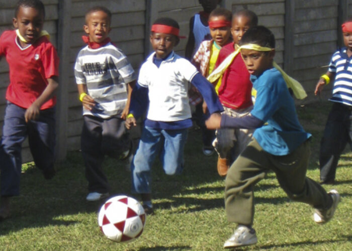 Brayden leads his team’s attack on goal during Holiday Club’s World Cup tournament at Breakthru Church. (Photo by Anna Yoder)Download high-resolution photo.
