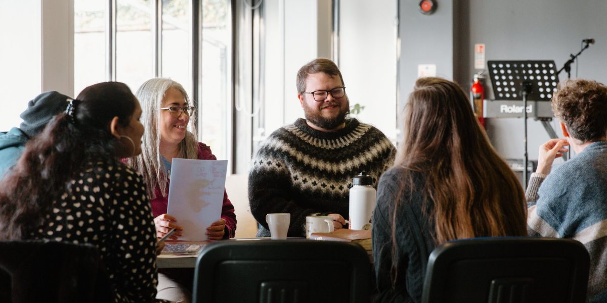 Austin Roberts is pictured with a group during a peacebuilding seminar at An Cuan.