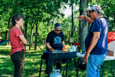 ​While Mary Mitchell cooks a Potawatomi meal for Trail of Death participants