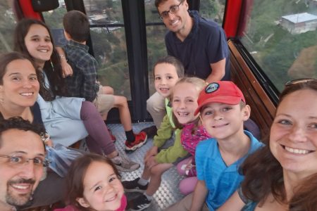Laura's cousin, Amaris Allan, her husband, Stuart, and their children are pictured with the Sharp family on a cable car overlooking El Paraíso in south Bogotá on June 14, 2026. Their relatives were visiting from Pennsylvania. Photo by Laura Sharp.
