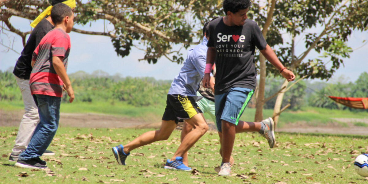 ​Biz Bomberger (right) plays soccer at a youth camp during his participation in a Youth Venture trip to Peru. Photo provided. 