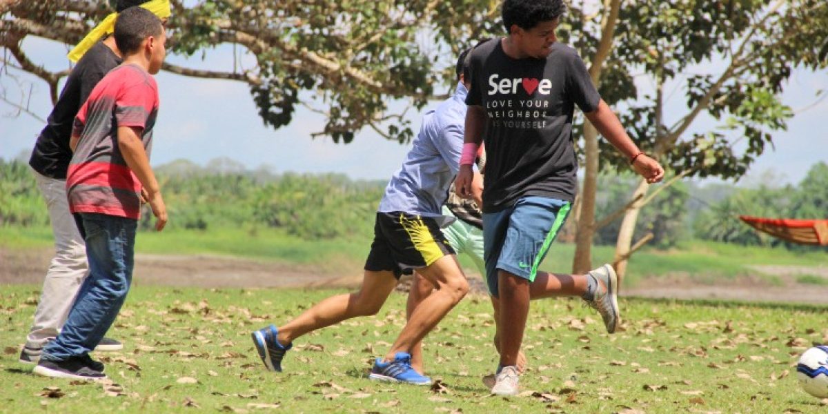 ​Biz Bomberger (right) plays soccer at a youth camp during his participation in a Youth Venture trip to Peru. Photo provided. 