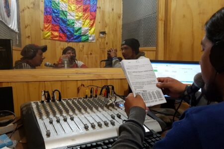 ​David Díaz operates the console at the Toba Qom radio station located at the Centro Educativo Saỹaten (Qom Knowledge Educational Center) in Castelli