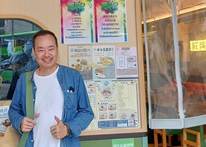 Andi Santoso standing in front of a restaurant