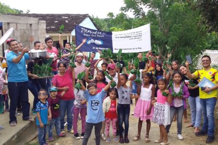 ​These youth and children hand out meals on the International Day of Peace as part of the Colombia Mennonite Church's celebration called "Pan y Paz" (Bread and Peace). This distribution of food symbolizes that justice making (everyone needs something to eat) is integral to peace-making. Photo by Kelly Frey Martin.